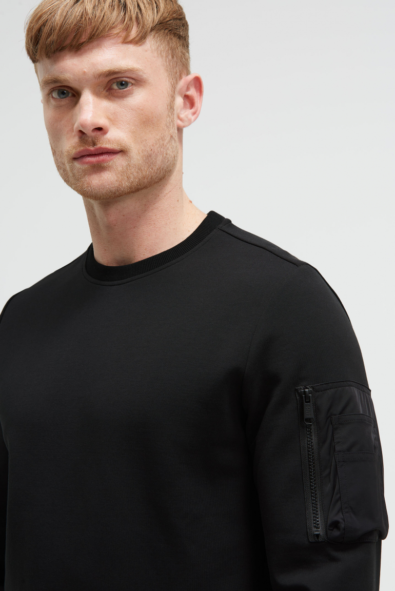 Sweatshirt aus Interlock mit Ärmeltasche und Artwork