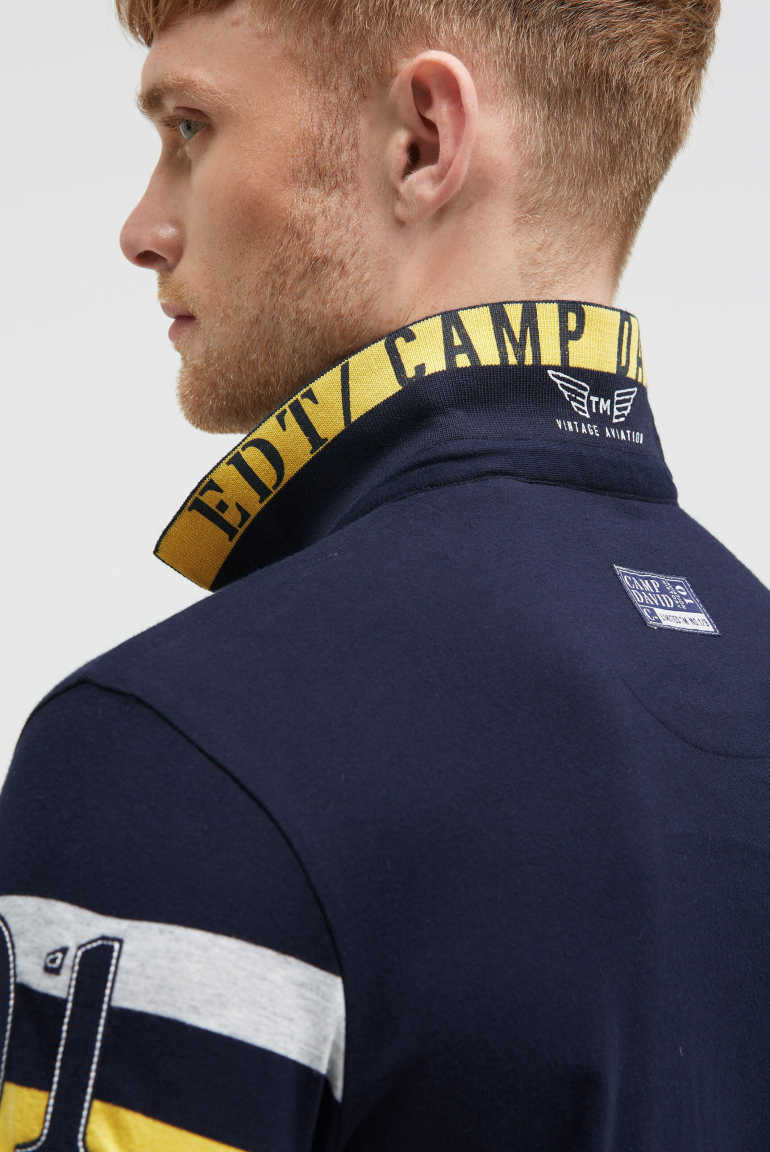 Kurzarmpolo mit Streifen-Design und Artworks