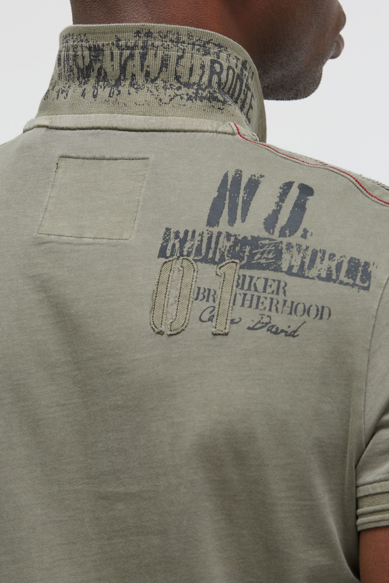 Kurzarmpolo mit Tapes und Logo-Applikationen